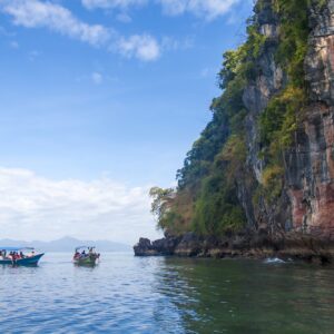 Perfect vacation in Langkawi, Malaysia. Tourist boats in the sea exploring the scenery.