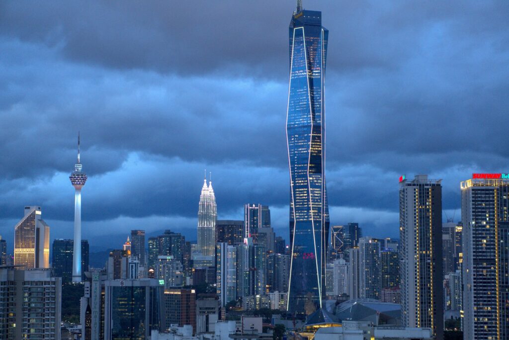 Modern skyscrapers in a city skyline at dusk