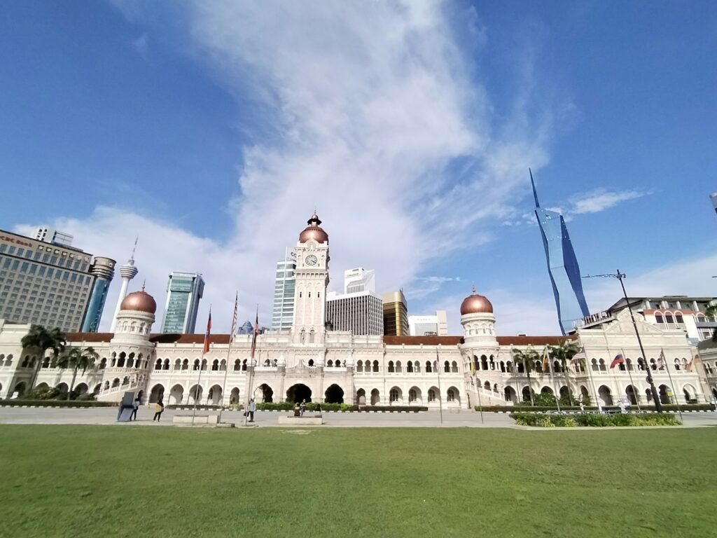 a large white building with a clock tower