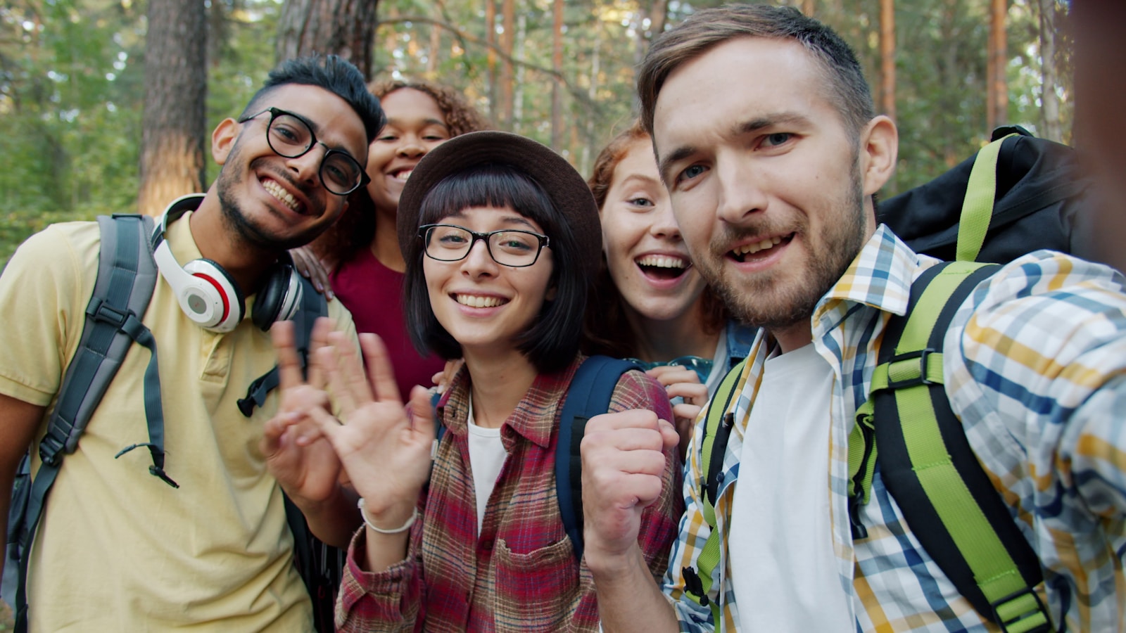 Group of friends taking a selfie in a forest